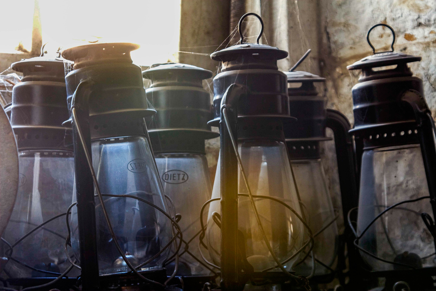 antique jars in a dusty window