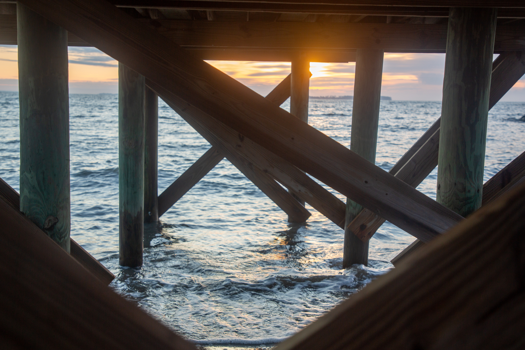 sunset under the pier