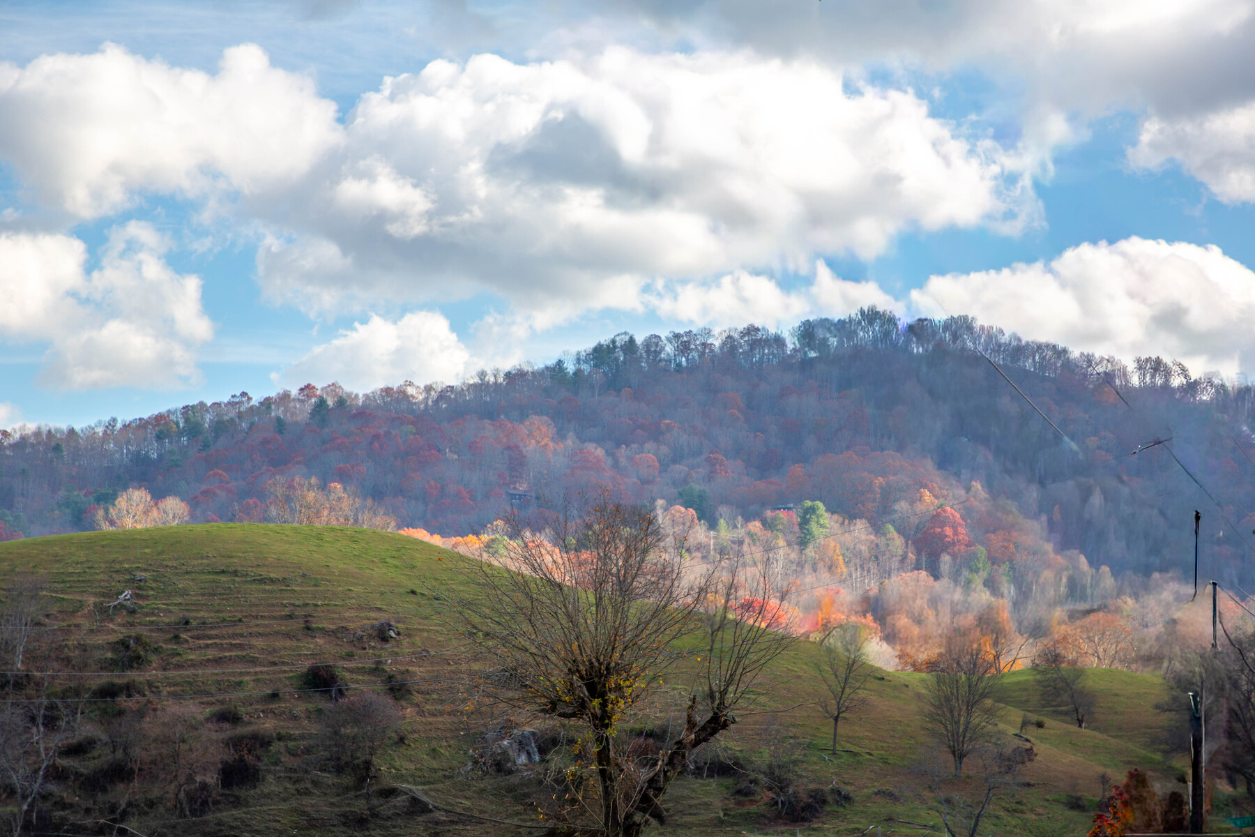 puffy clouds over the mountains
